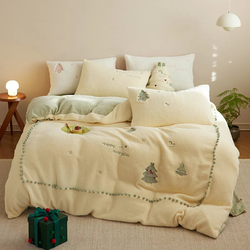 Milk fibre four-piece bedding set with green Christmas tree pattern on bed