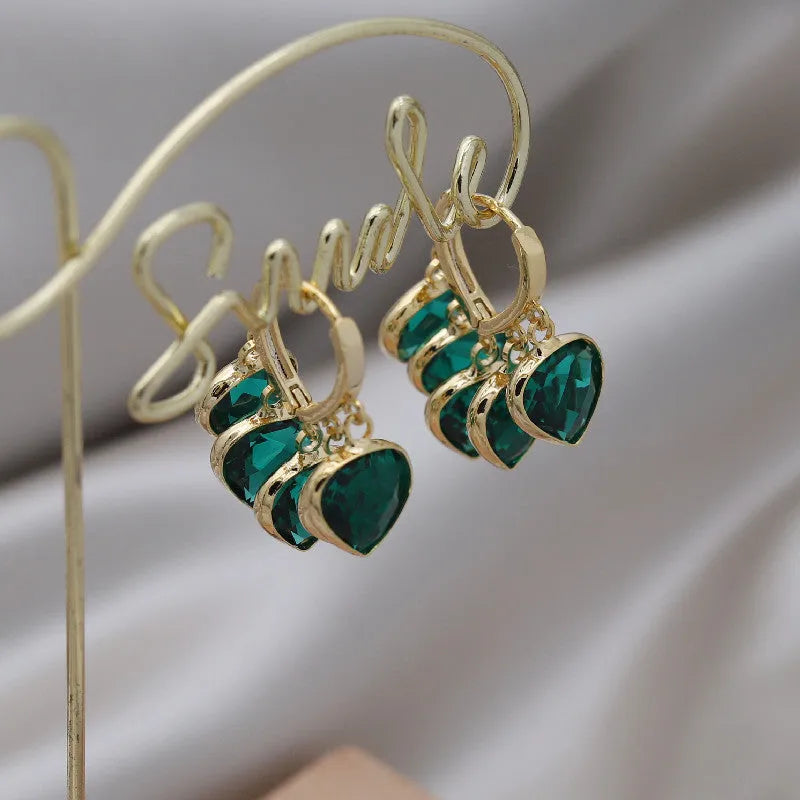 Green heart-shaped glass pendant ear clip earrings with alloy inlay in Korean style for women.
