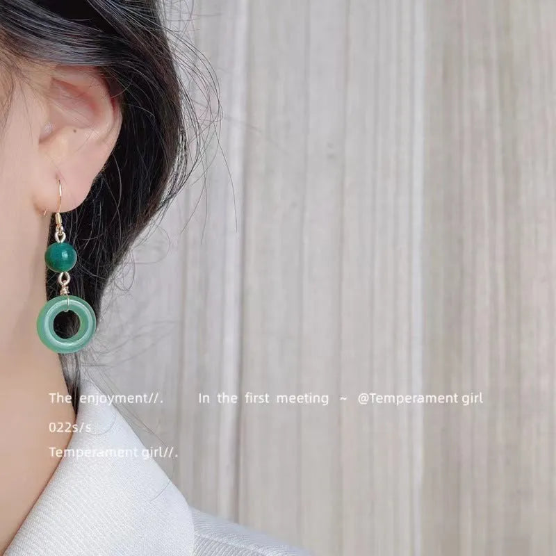 Geometric peace buckle earrings with green jade colour and 14K gold plating