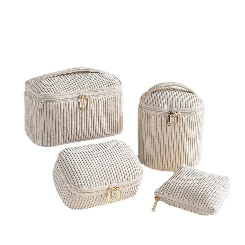 Four cube makeup bags in blue with dots pattern arranged as travel set