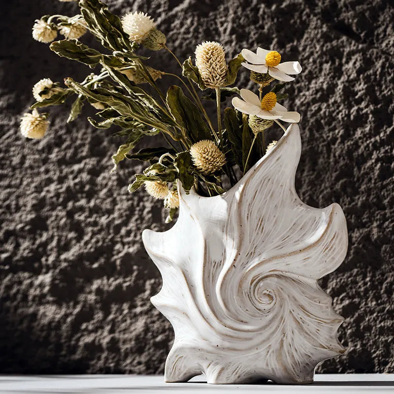 French art ceramic vase with coloured glaze in European retro style on wooden table