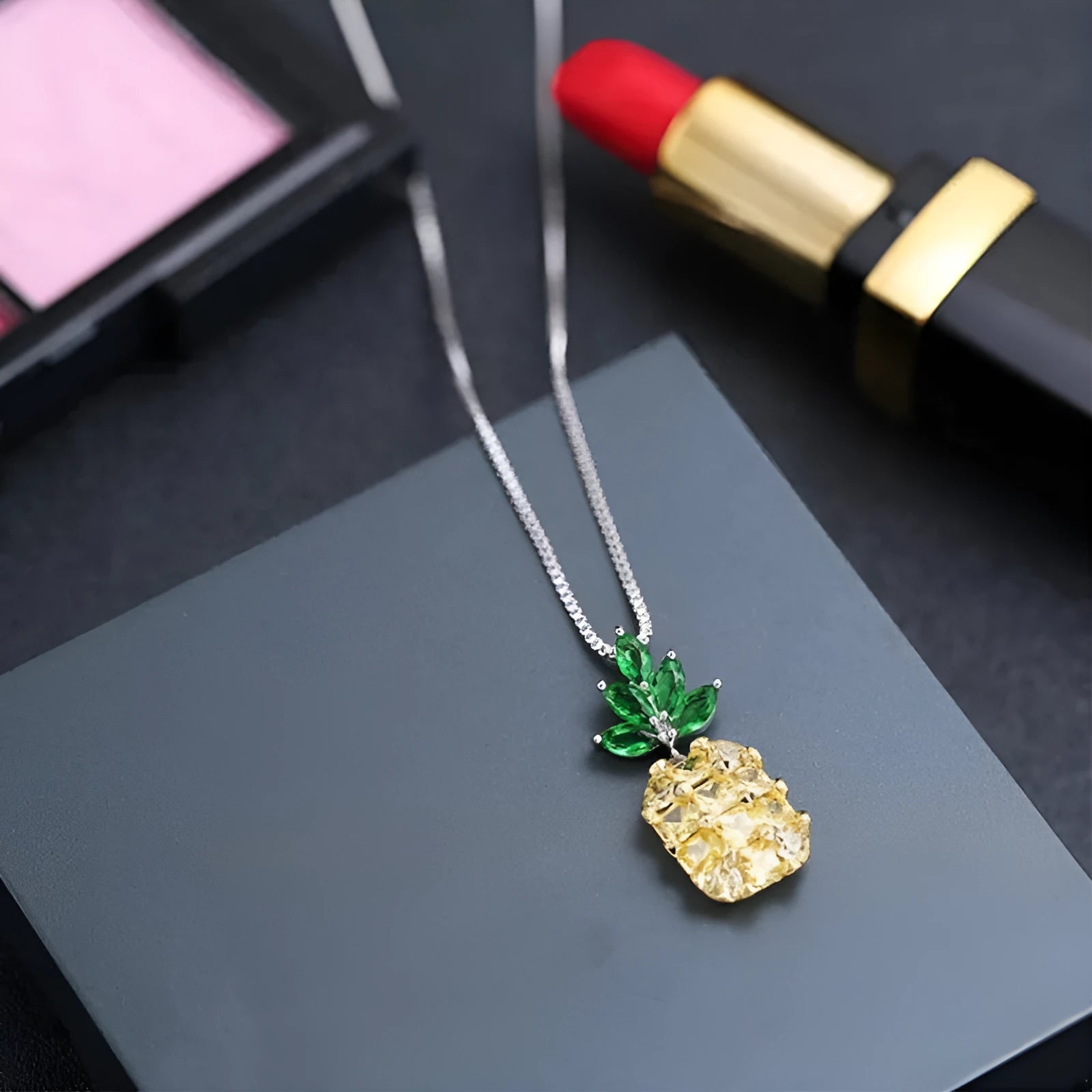 Silver pineapple charm necklace with geometric diamond pattern on adjustable chain