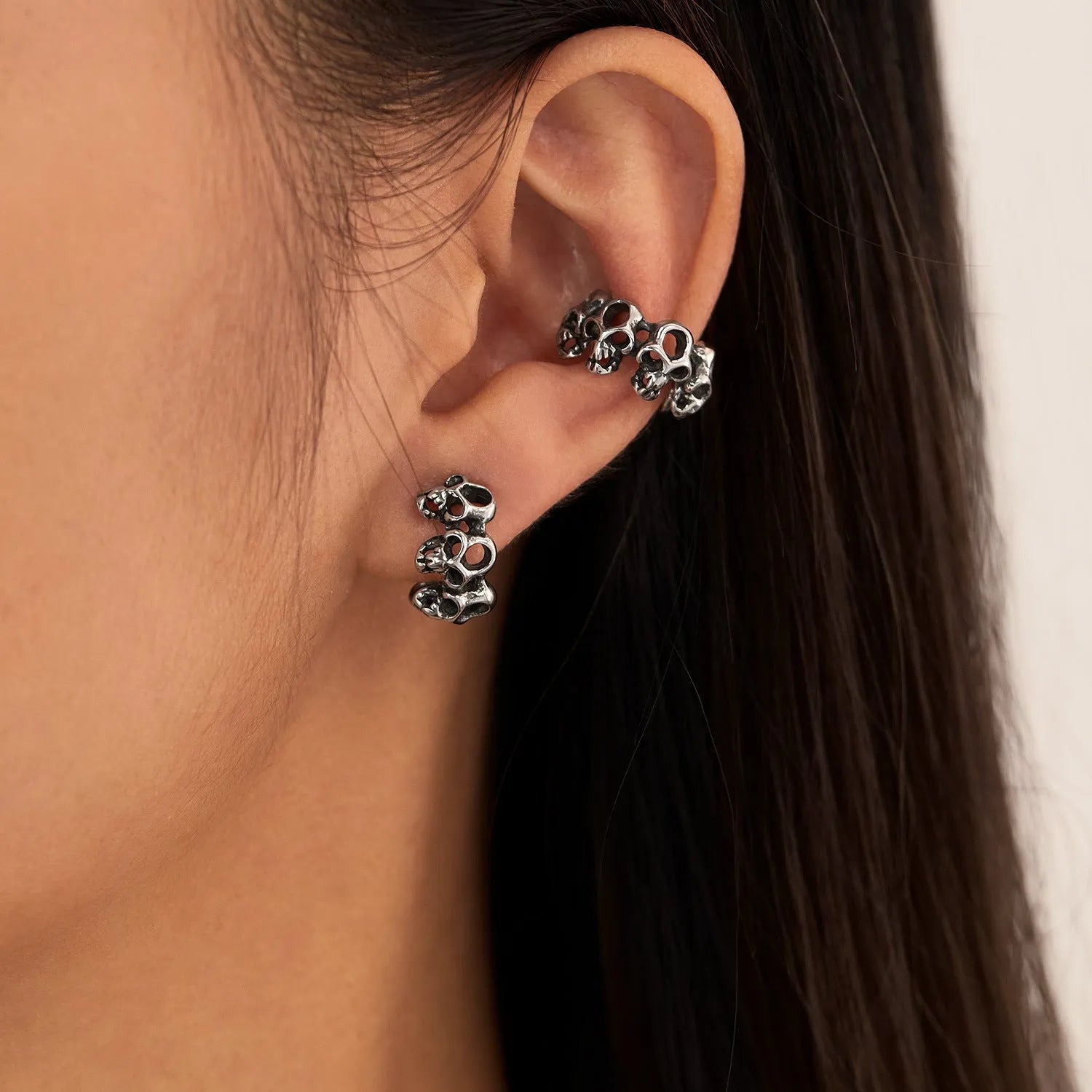 Retro hollow skull ear clip earrings with stainless steel construction and geometric hip hop style design