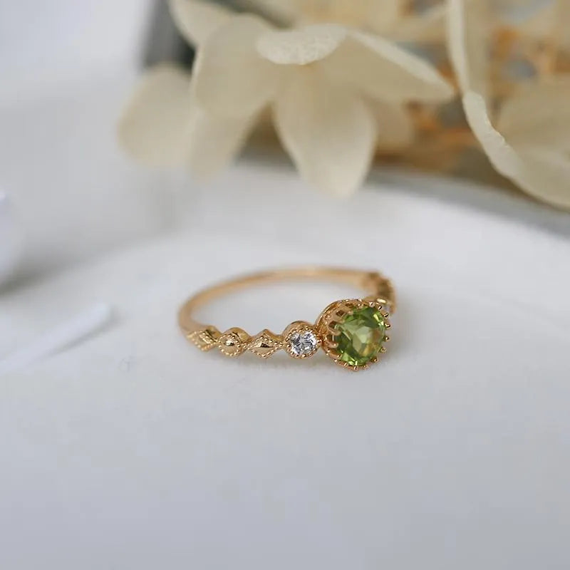 Geometric copper art ring with green imitation peridot finish in retro Japanese style.