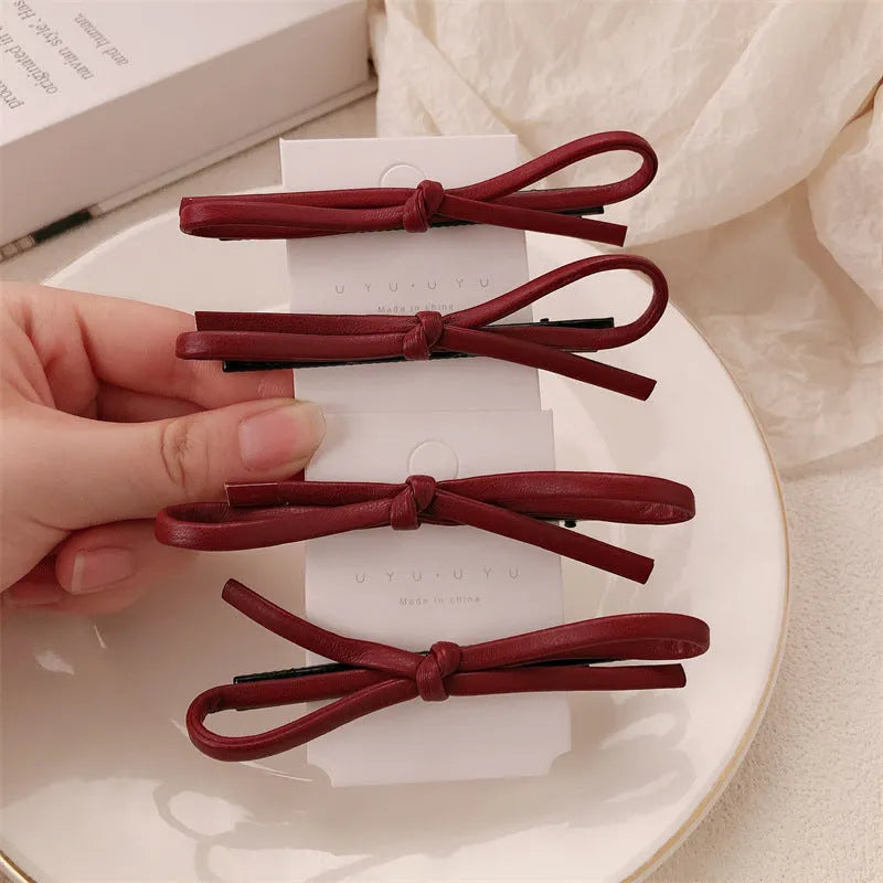 Wine red leather bow hair barrettes with handmade construction