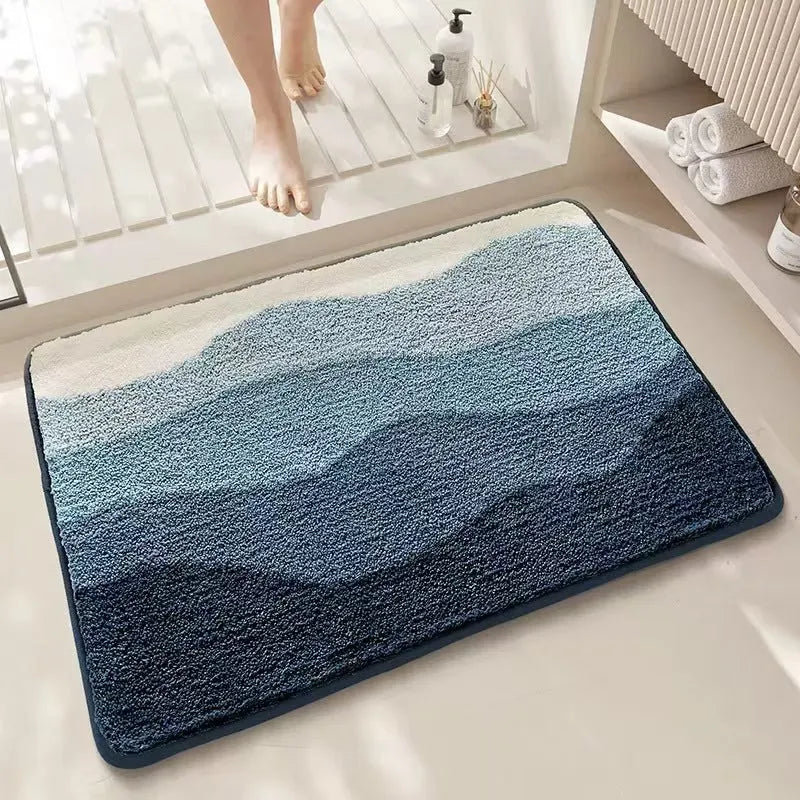 Rainbow pattern square carpet mat with plastic bottom in sky sea colour, shown in 40x60cm and 50x80cm sizes.