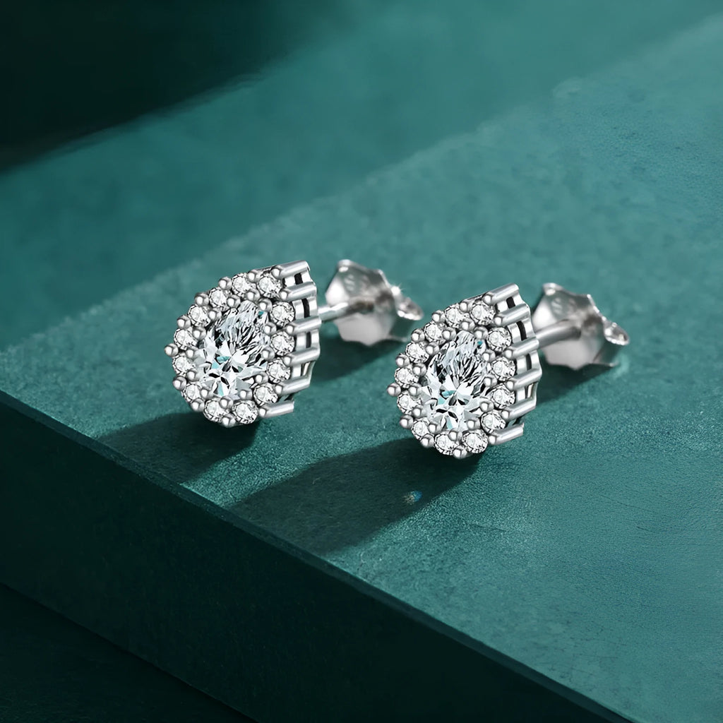 Women's silver water drop ear studs made from 925 sterling silver with diamond treatment