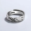Black geometric copper ring with adjustable opening and oval design elements for women's fashion jewellery