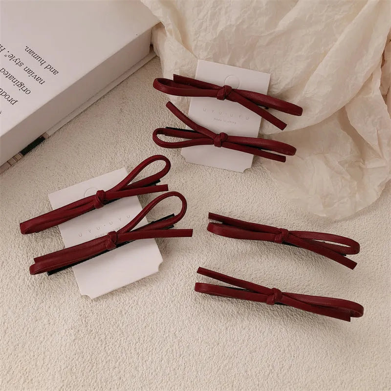 Wine red leather bow hair barrettes with handmade construction
