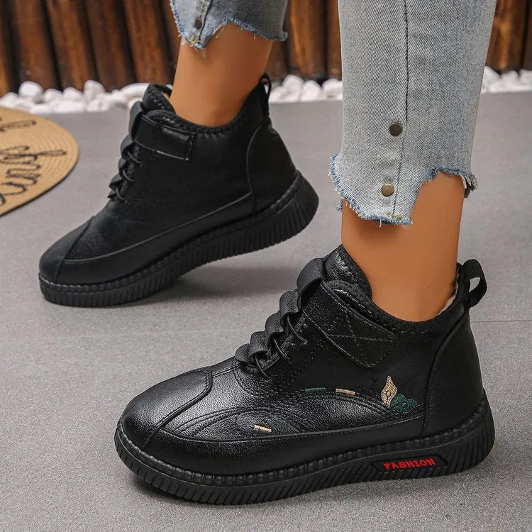 Women's black velvet cotton shoes with hollow-out design and textured rubber sole.