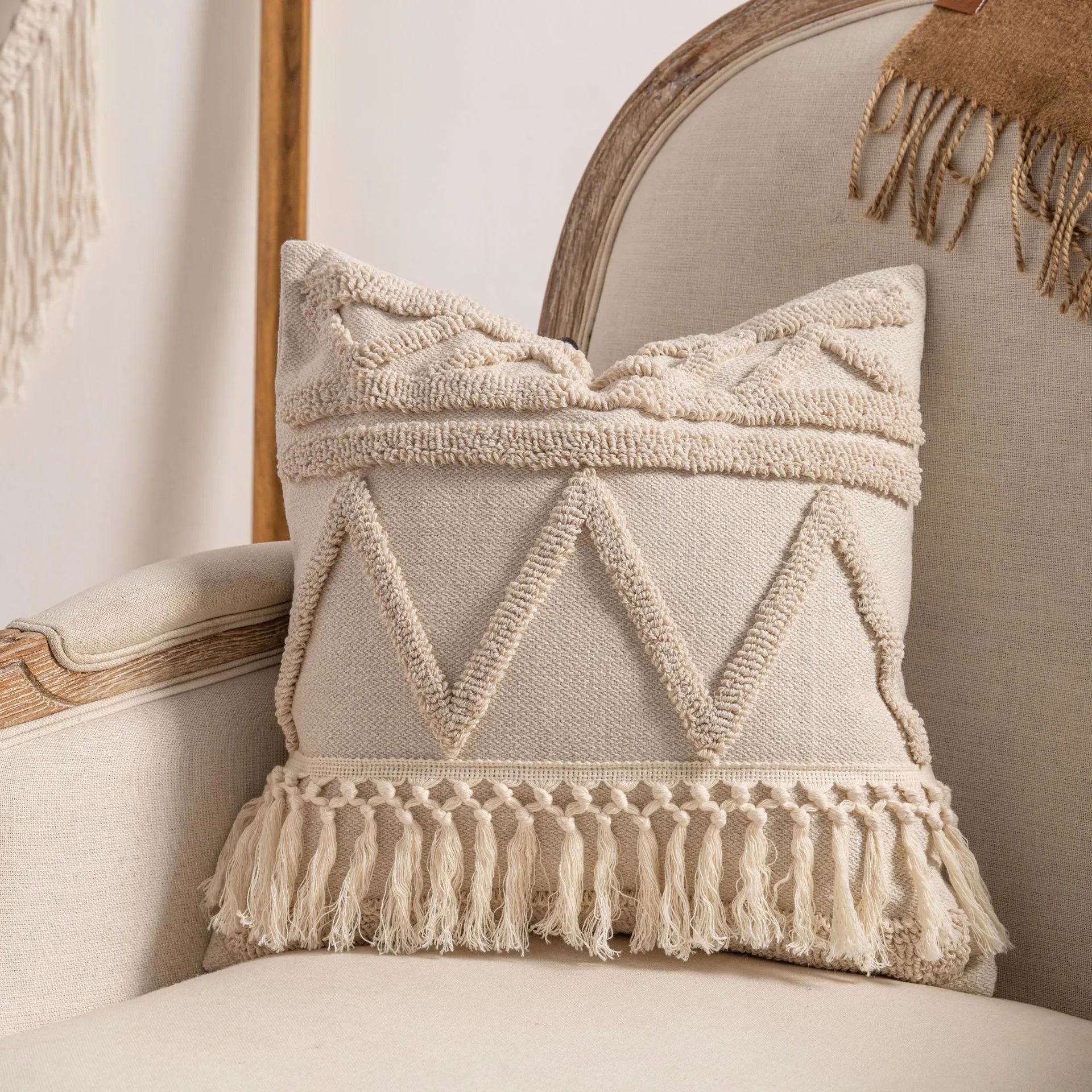 Knitted cushion cover with tassel trim in stripe pattern, available in six colours including spiral dots and woven rabbit fur