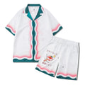 Men's plaid print beach shirt and shorts outfit set on a mannequin showing coordinated summer wear