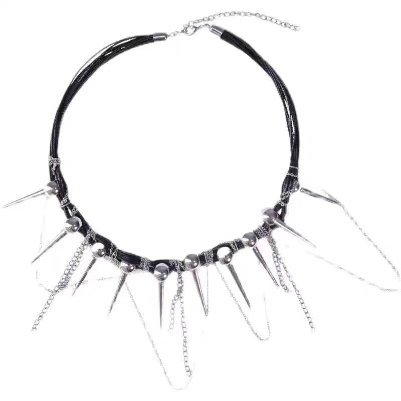 Women's leather necklace with winding beads, a tassel, and metallic point rivets.
