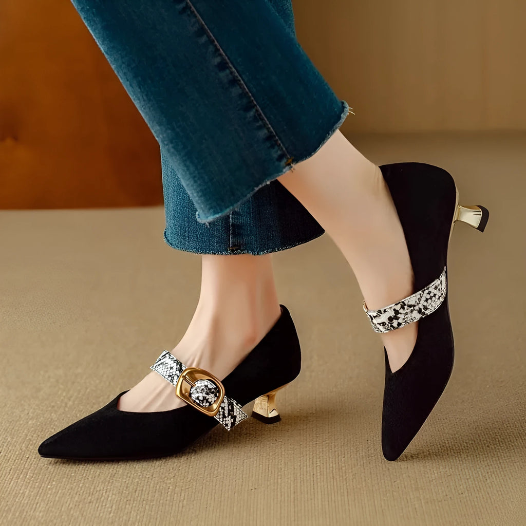 Black French pointed toe women's stiletto heels with an ankle buckle on a low-cut design.