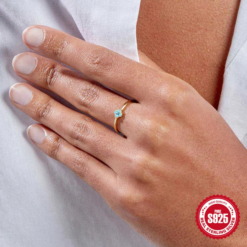 Simple silver turquoise ring for women with gold turquoise diamond finish on white background