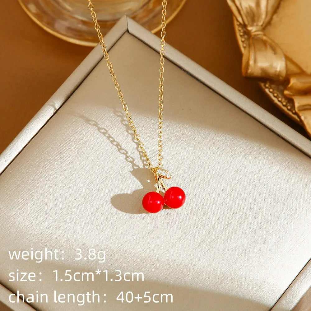 Indie fashion necklace with delicate cherry, strawberry and pepper pendant on a titanium steel O-ring chain.