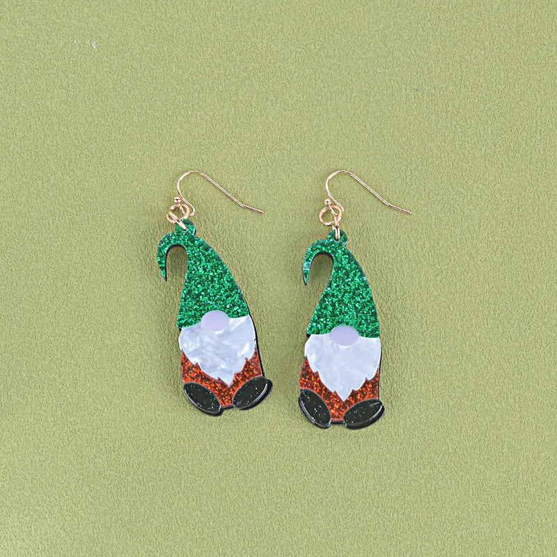 A pair of acrylic earrings shaped like cartoon Santa Claus figures with coloured hats.