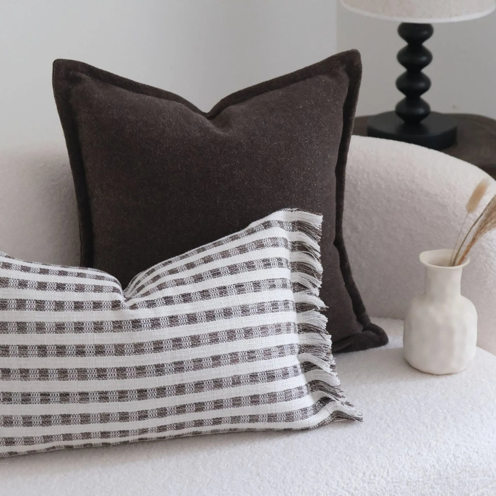 Coffee brown Chinese classical style cushion cover with stripe pattern on a living room sofa