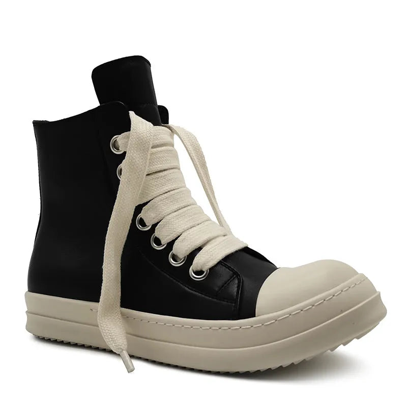 Black high-top leather sneakers with side zipper and round toe design on a white background
