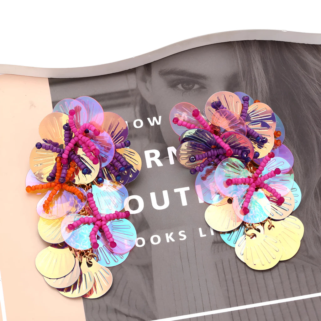 Handmade colourful flower and leaf earrings in an exaggerated dopamine style.