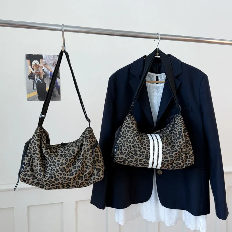 Leopard print crossbody messenger bag with stitching details and shoulder strap