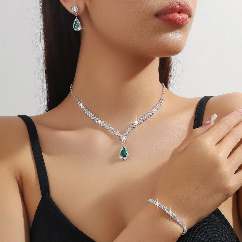 Claw chain necklace and earrings set with drop-shaped rhinestones in multiple colour options