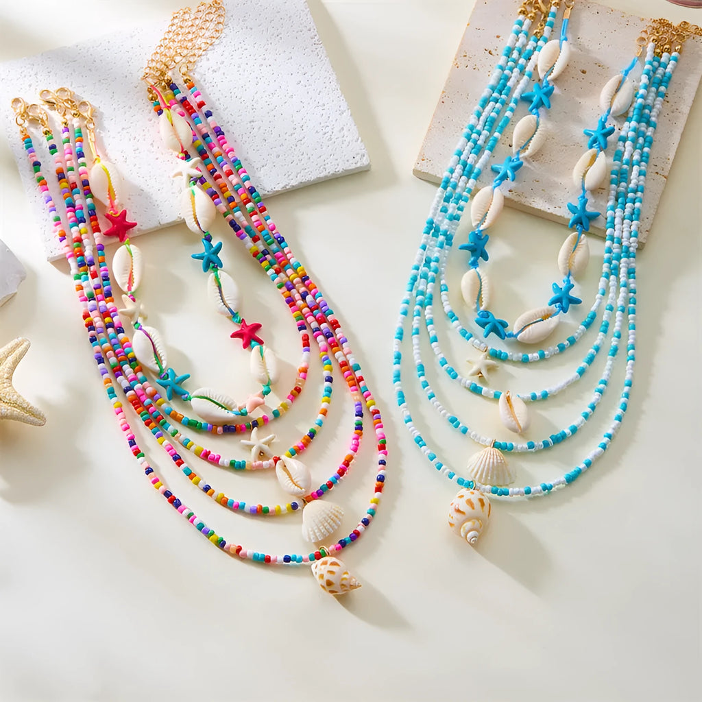 Five multi-layer women's necklaces with starfish shell conch bead designs in blue and mixed colours