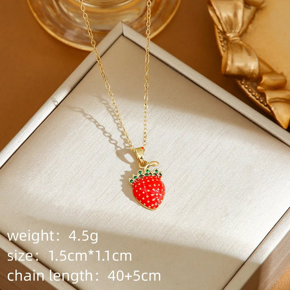 Indie fashion necklace with delicate cherry, strawberry and pepper pendant on a titanium steel O-ring chain.