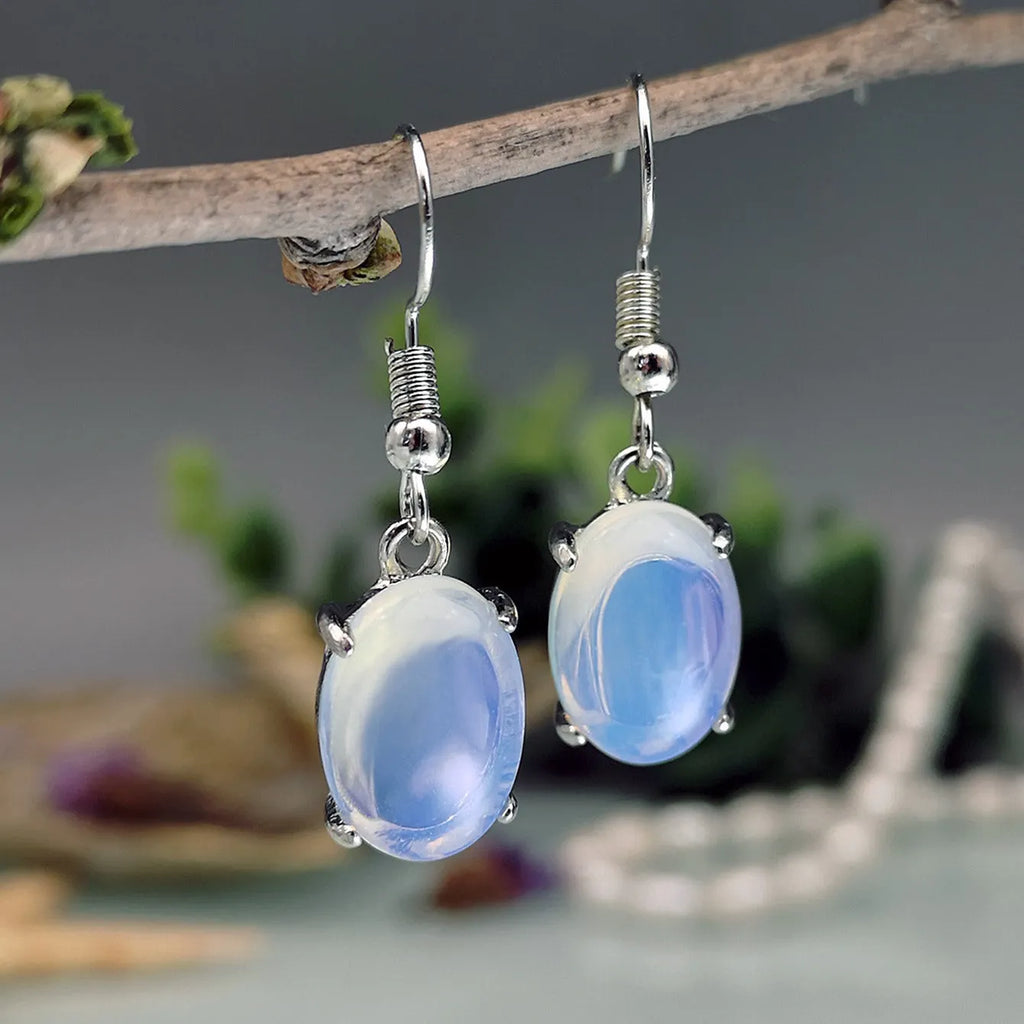 Moonlight white opal drop earrings with cross-shaped retro design and electroplated alloy finish