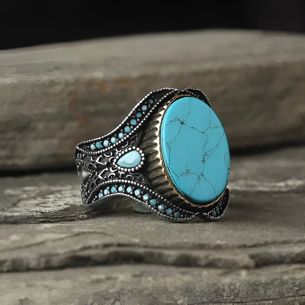 Men's antique silver alloy ring with a round band and a central turquoise gemstone.