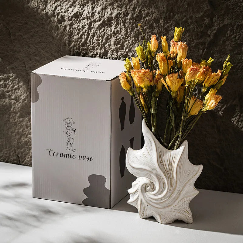 French art ceramic vase with coloured glaze in European retro style on wooden table