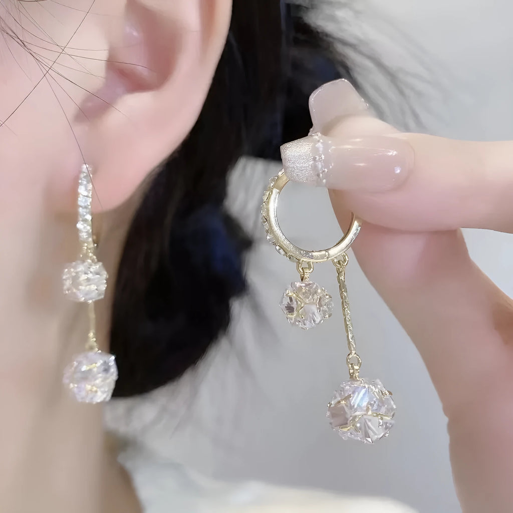 Silver-coloured copper tassel earrings with confession balloon and rhinestone ball double pendant design