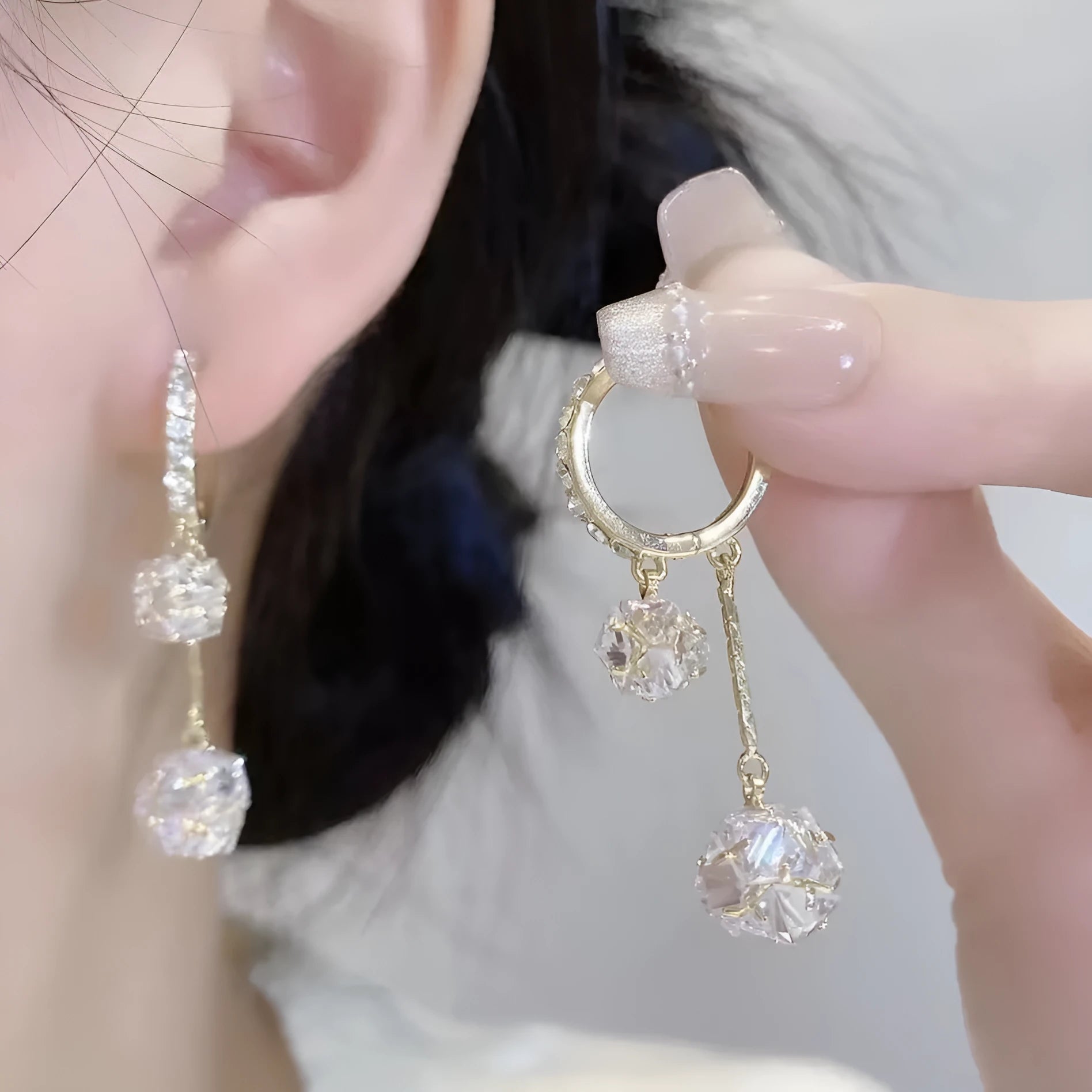 Silver-coloured copper tassel earrings with confession balloon and rhinestone ball double pendant design