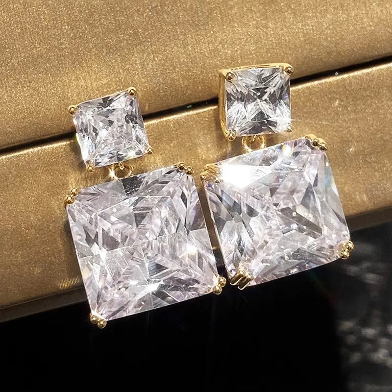A pair of geometric square design copper earrings in a choice of white gold or gold colour.