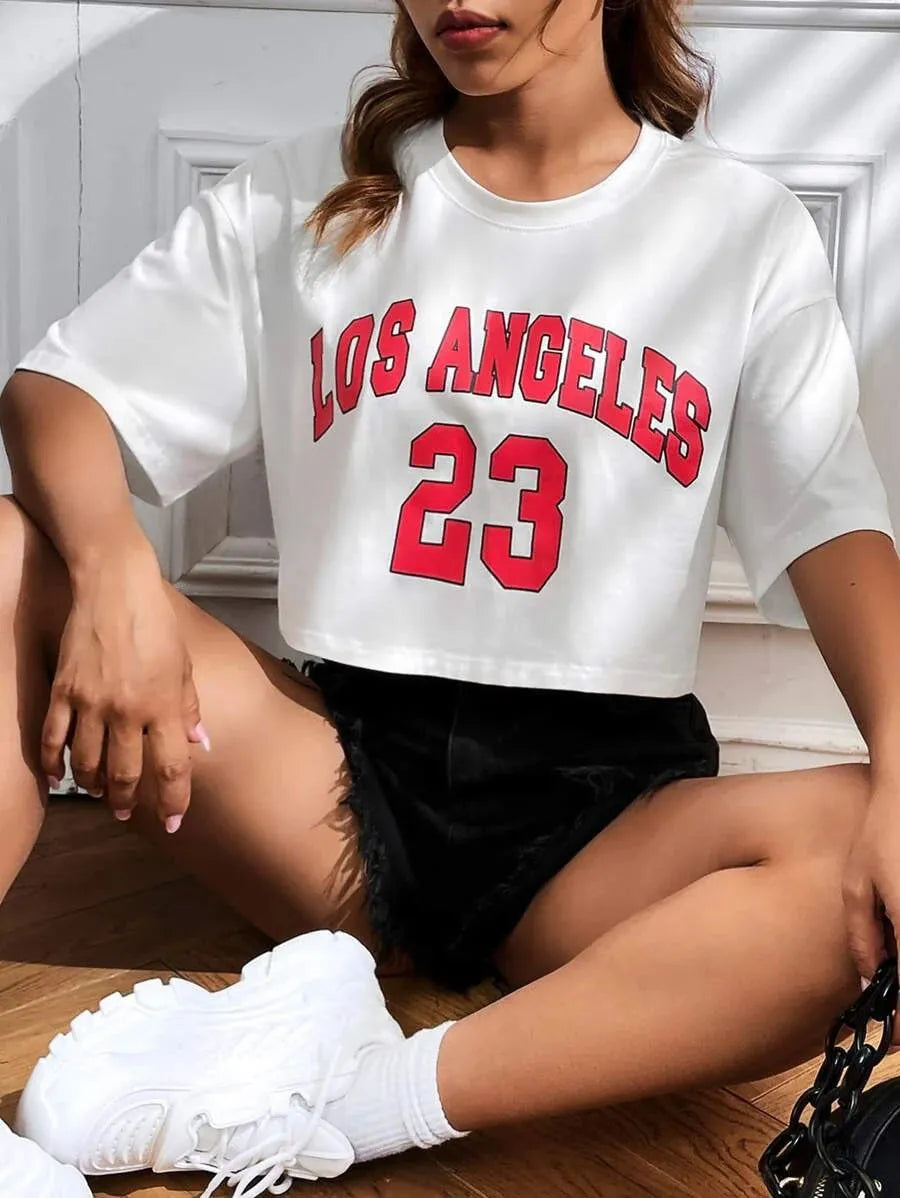 Black loose fit cotton t-shirt with exposed navel design and white English letter printing on front