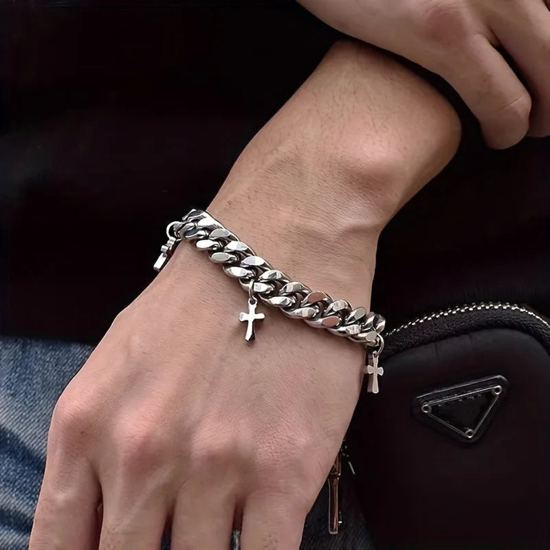 Men's titanium steel bracelet showing geometric cross design on a wrist.
