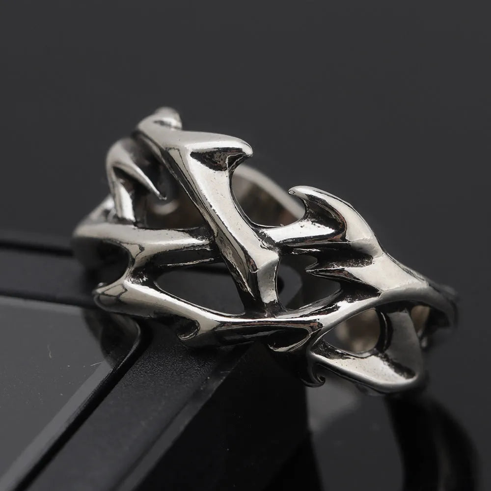 Copper thorn flower ring with adjustable opening and geometric design.