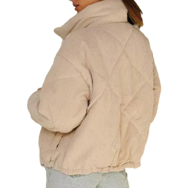 Apricot-coloured women's corduroy jacket with a stand collar and front zip, shown on a hanger.