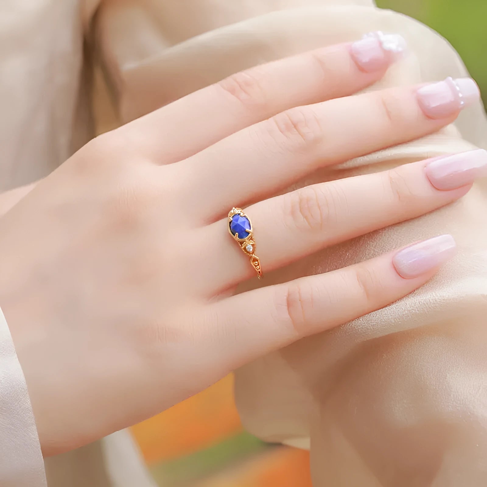 Silver alloy geometric oval ring with lapis lazuli blue stone and round decorative elements