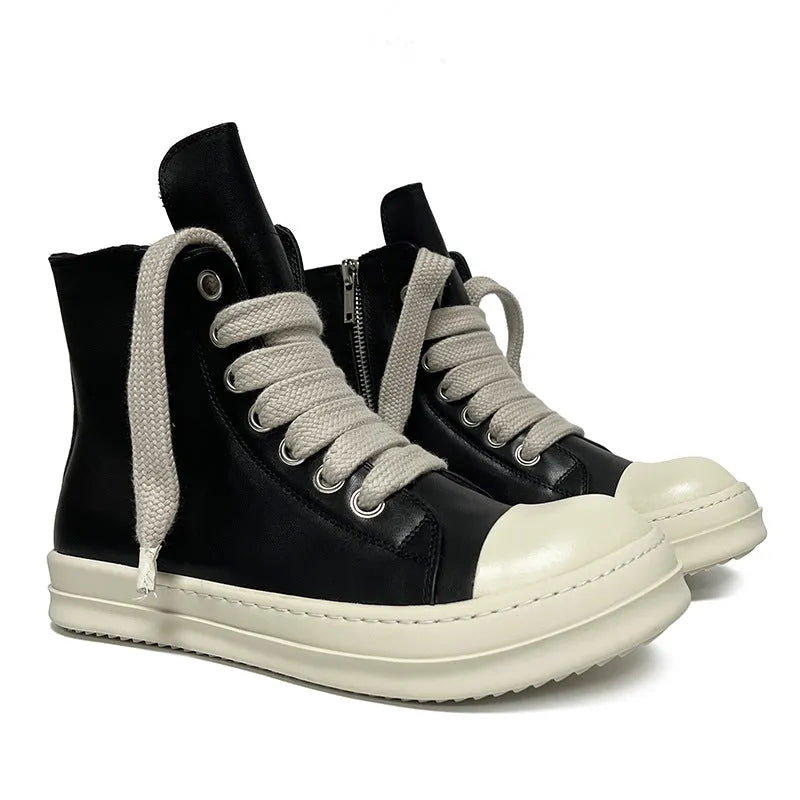 Black high-top leather sneakers with side zipper and round toe design on a white background