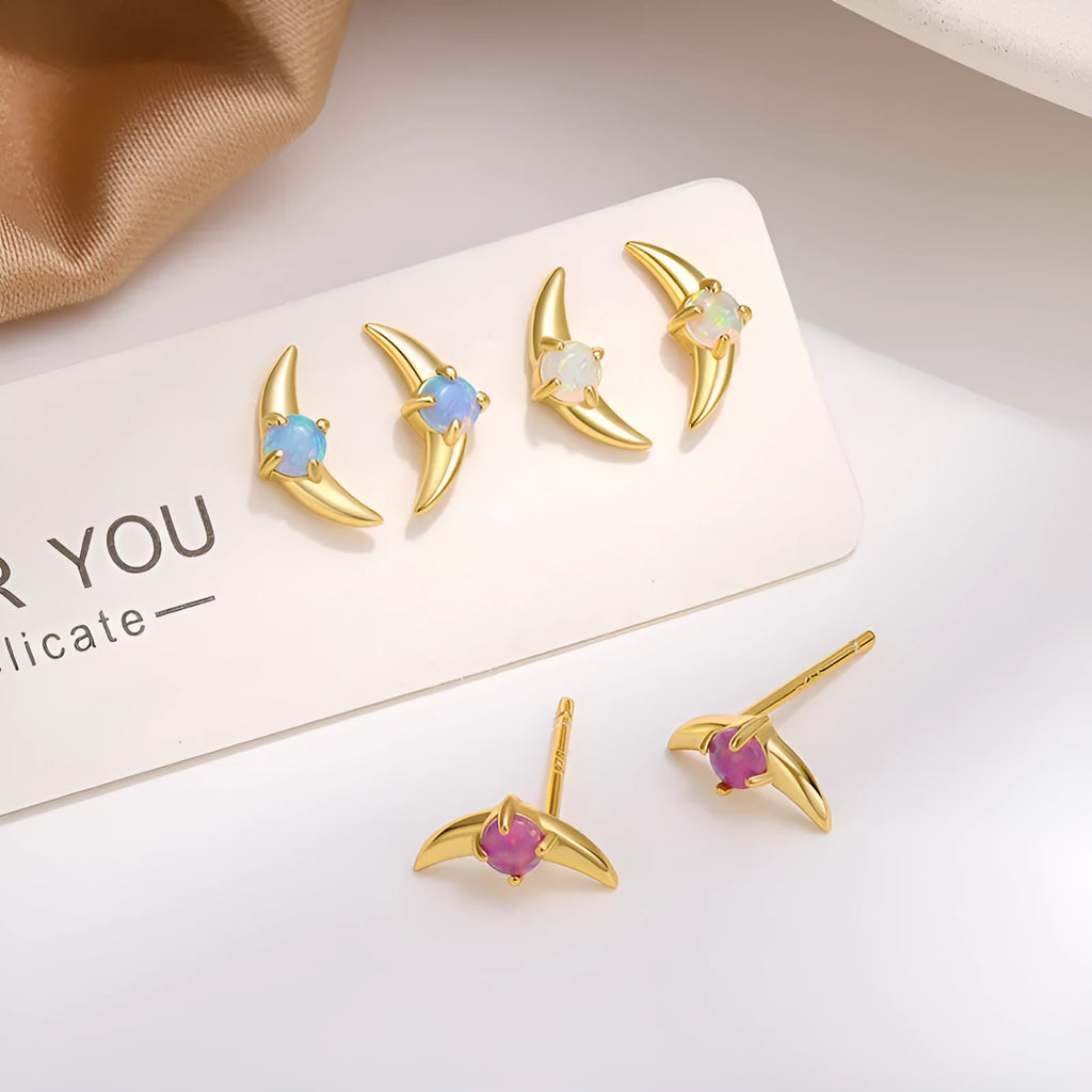 A pair of geometric 925 silver earrings with a stone accent, shown in gold and platinum colour options.