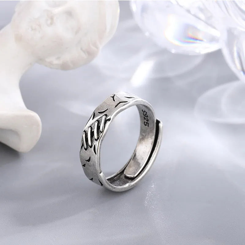 Black geometric copper ring with adjustable opening and oval design elements for women's fashion jewellery