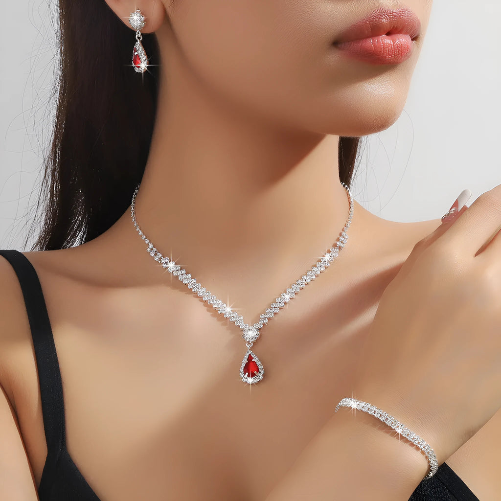 Claw chain necklace and earrings set with drop-shaped rhinestones in multiple colour options