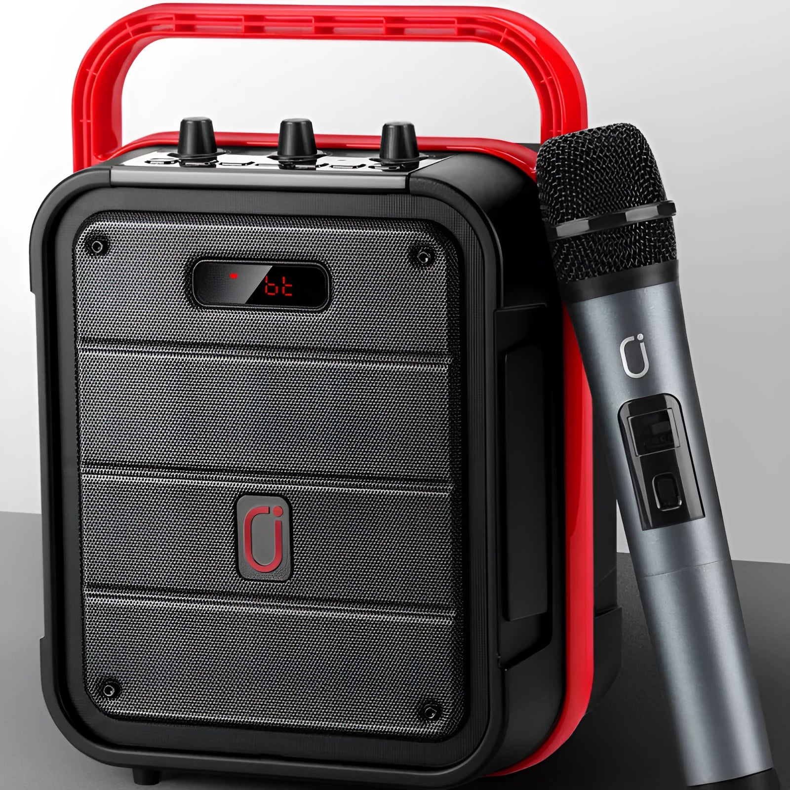 MS62AI portable Bluetooth speaker with wireless microphone, remote control, and charging cable.