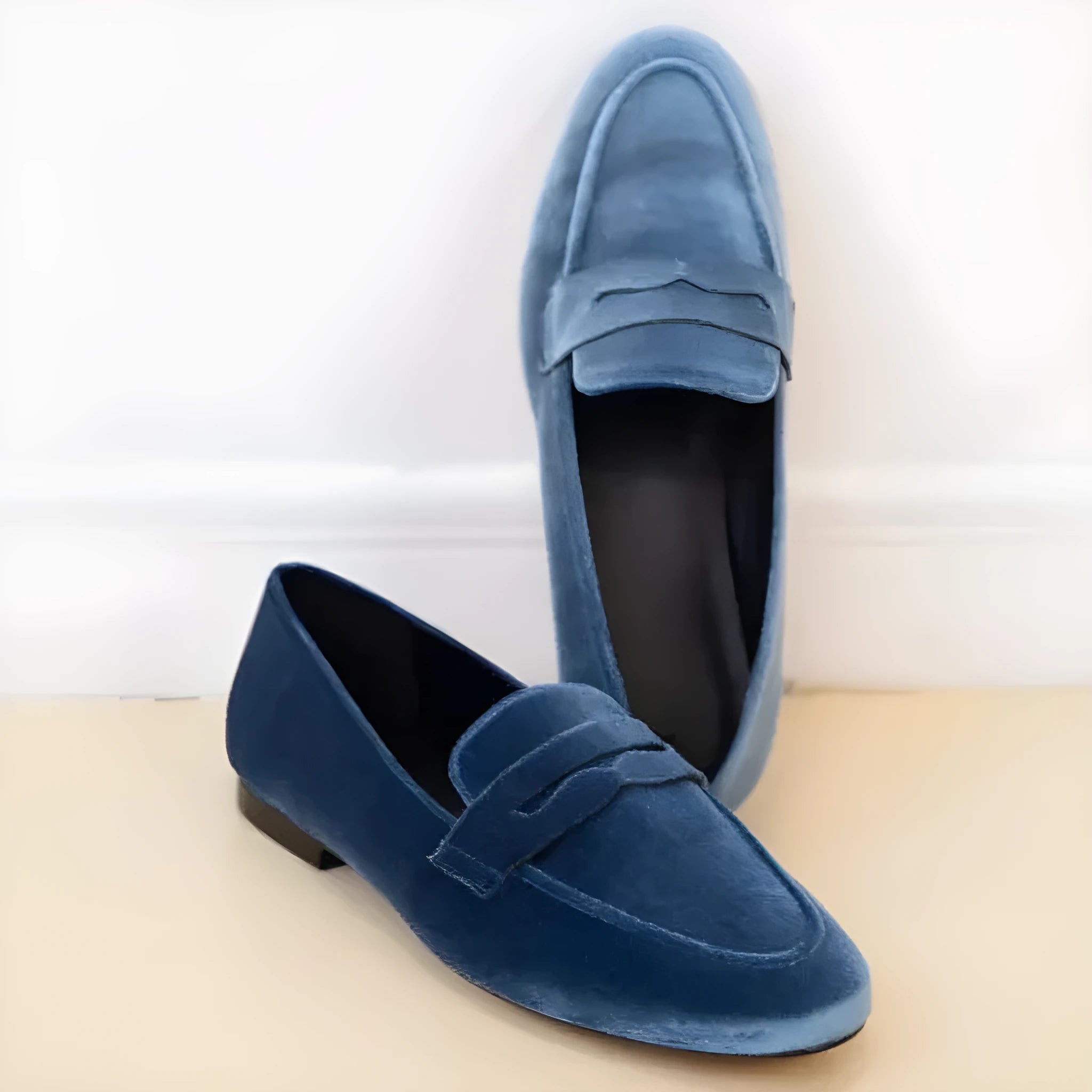 Blue and black sole suede loafers with round toe and low top design