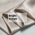 Double-sided silk duvet cover in six solid colours showing smooth plain weave texture