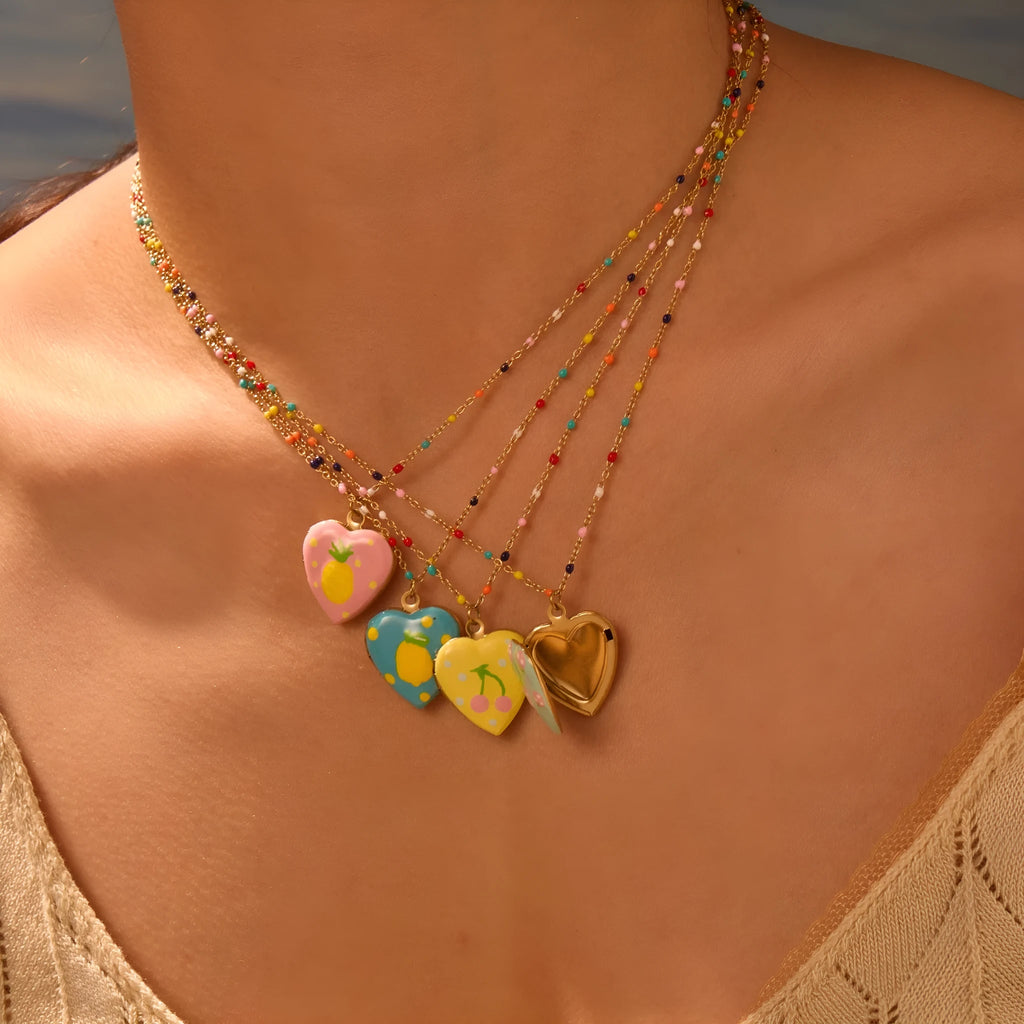 Gold plated fruit charm necklace with heart-shaped pendant on adjustable stainless steel chain