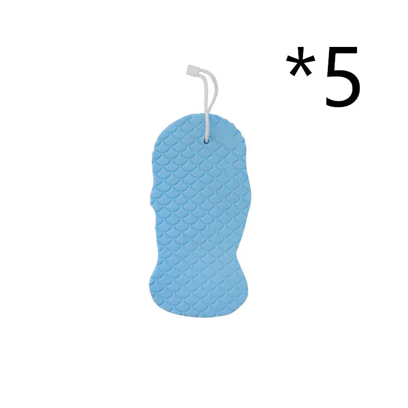3D white bath sponge with fish scale pattern for gentle body exfoliation.