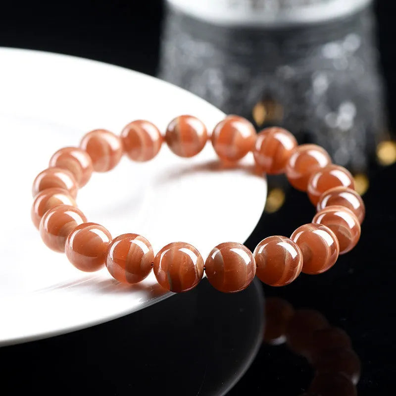 Natural old mine rhodochrosite round beads bracelet with Ruyi design element