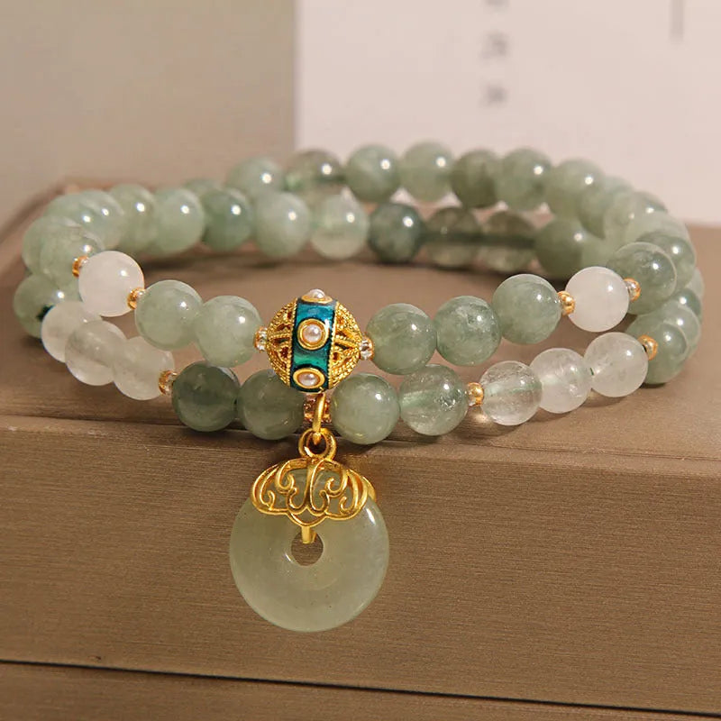 Aventurine double-layer jade bracelet with rhinestone accents and peace buckle closure in emerald green